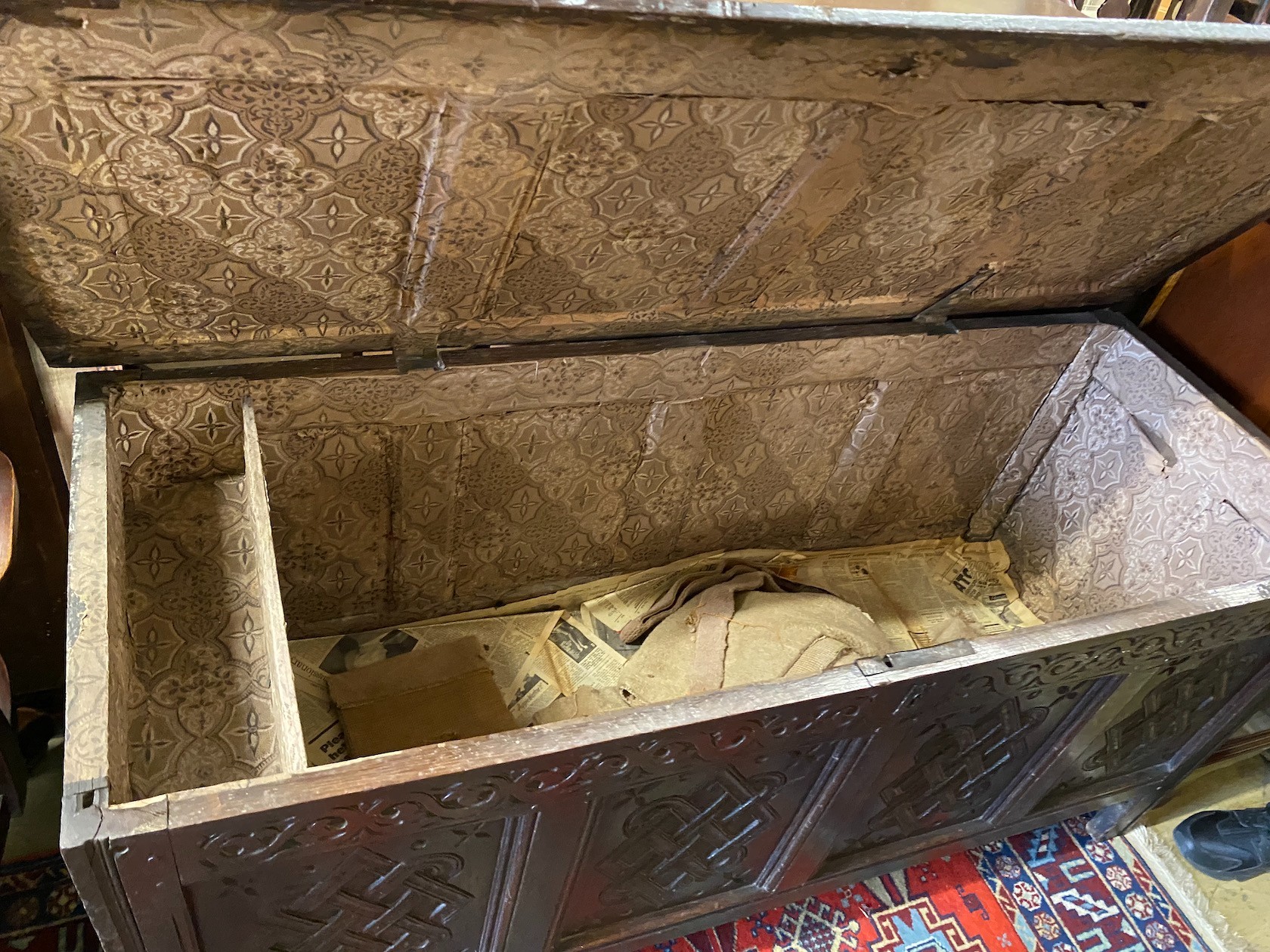 An early 18th century carved oak West Country coffer, length 152cm, depth 58cm, height 71cm